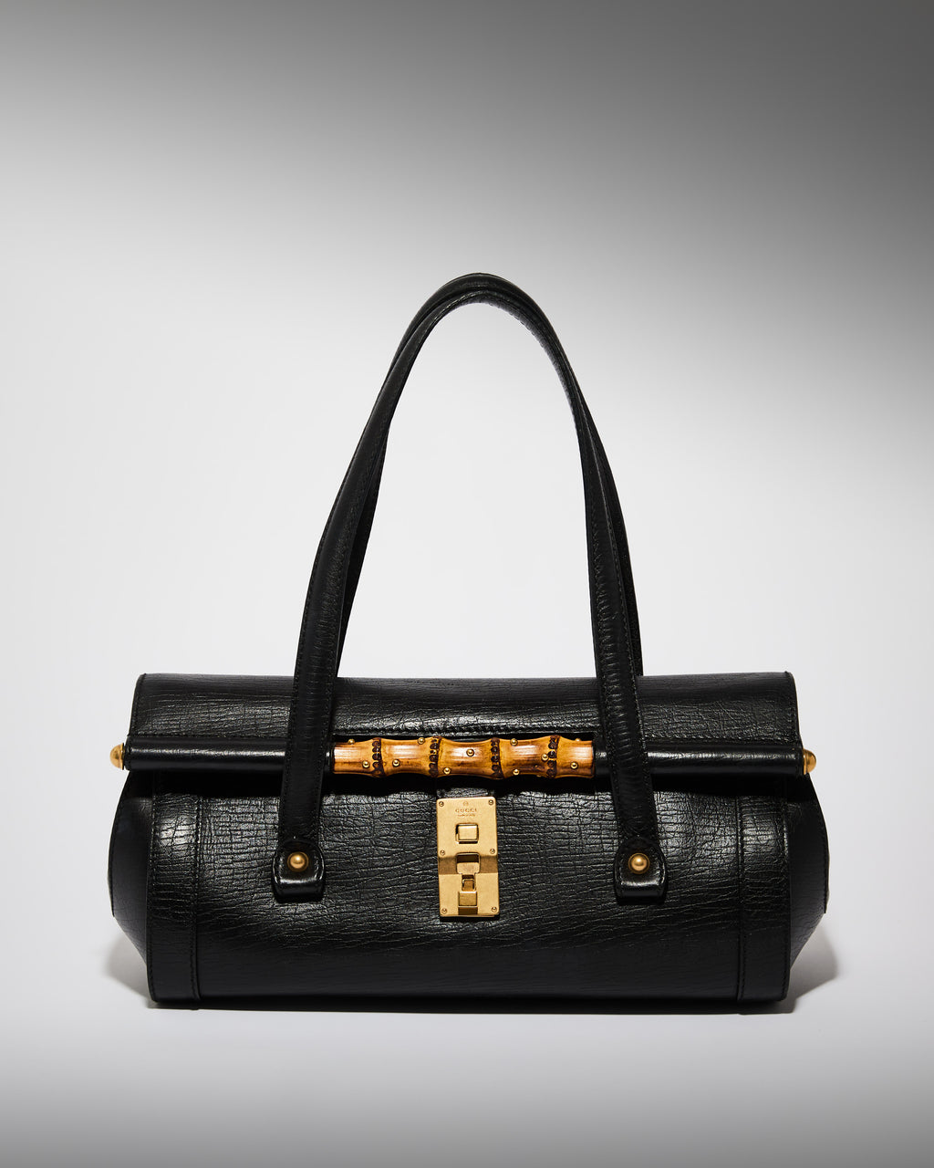 Vintage Gucci Tom Ford era bamboo bullet bag in black leather with gold hardware
