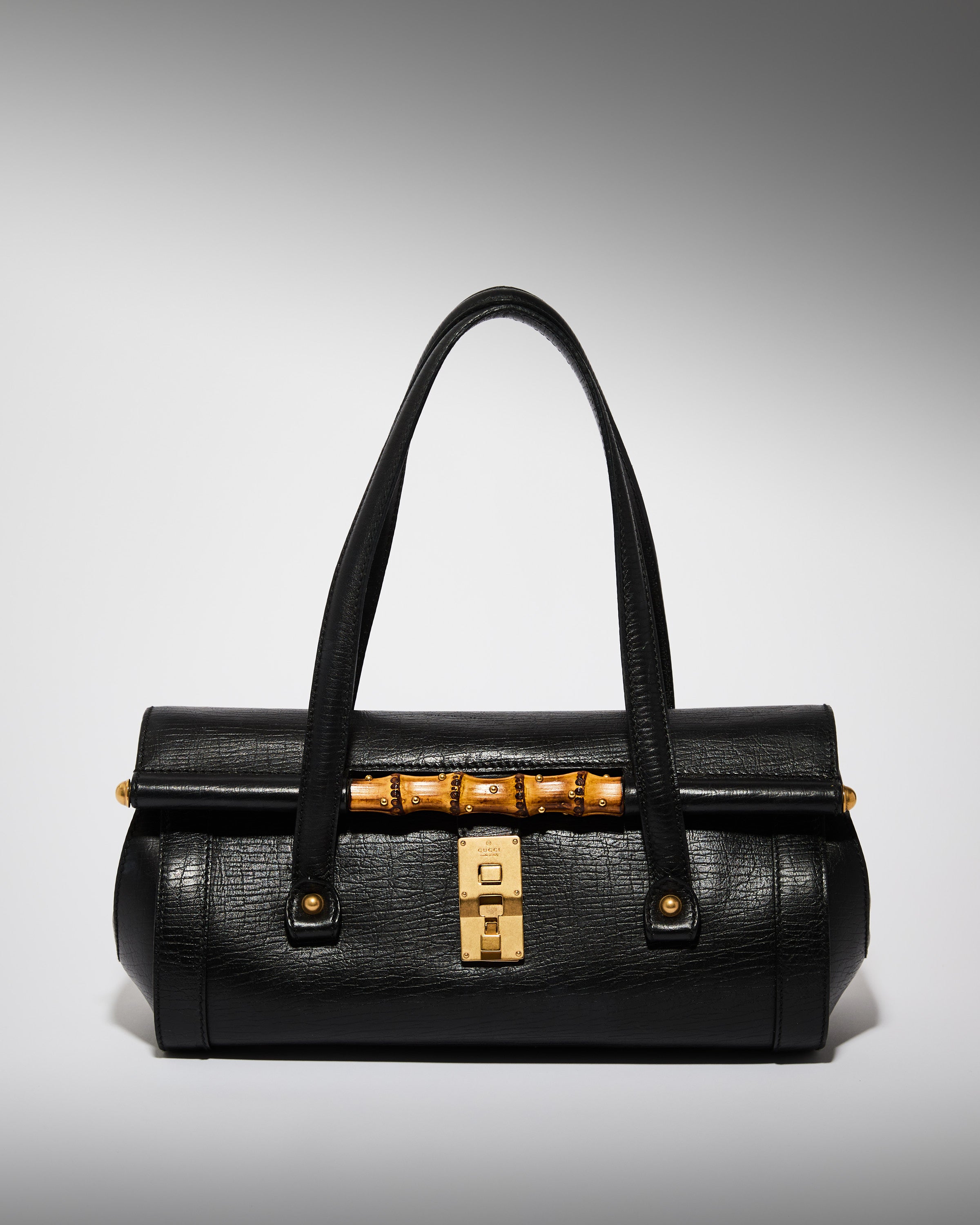 Vintage Gucci Tom Ford era bamboo bullet bag in black leather with gold hardware
