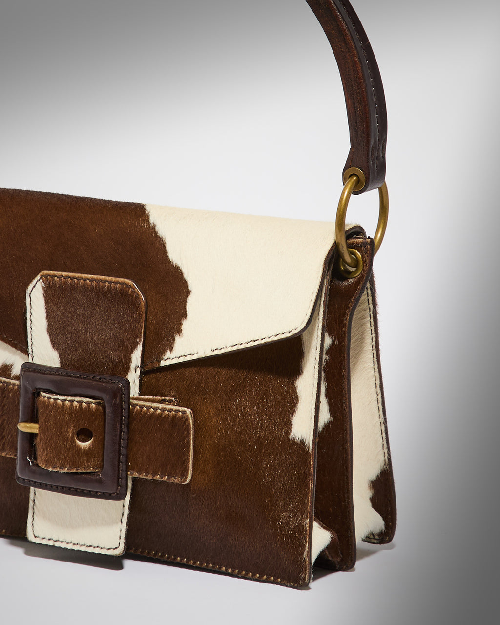 Side view of vintage Miu Miu pony hair shoulder bag with leather trim.